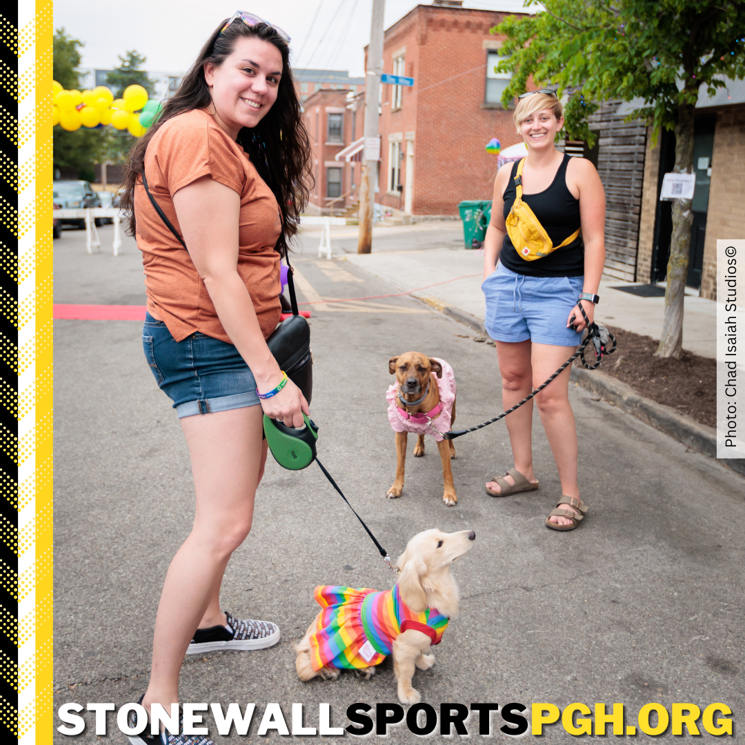 Contestants Finn and Reese pose with their humans at the Stonewall Kickball Pittsburgh Paw Pageant.
